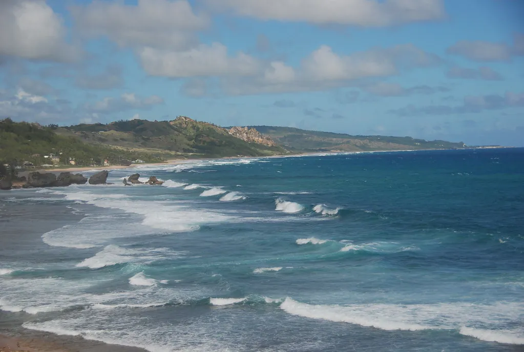 Surfing waves on the Atlantic Ocean, Barbados